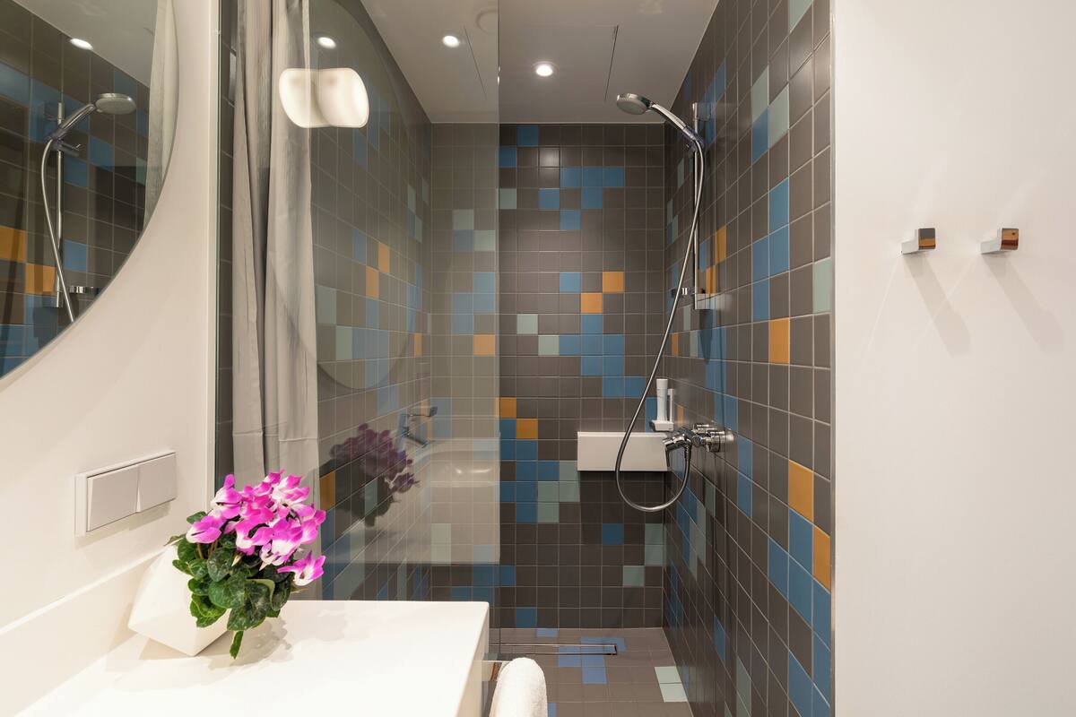 standard twin room | bathroom | eco-friendly toiletries, hair dryer, towels, soap