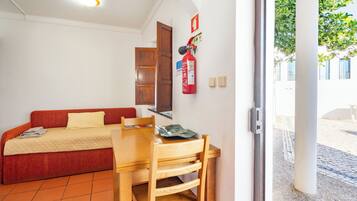 Studio | Living area | Flat-screen TV