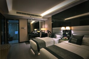 Premium bedding, down comforters, minibar, in-room safe