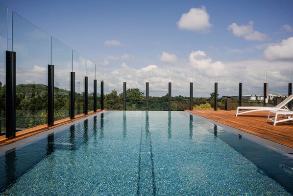 Indoor pool, outdoor pool, open 9:00 AM to 9:00 PM, pool loungers