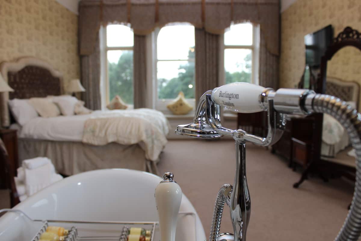 luxury suite, 1 king bed, garden view | egyptian cotton sheets, premium bedding, memory-foam beds, desk