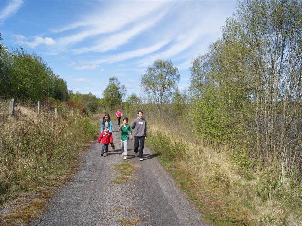 A gravel path with people walking.