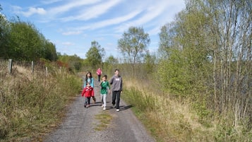 A gravel path with people walking.