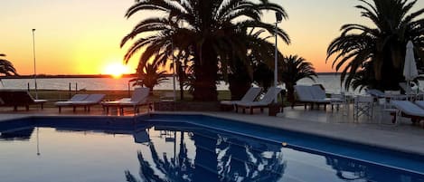 Indoor pool, outdoor pool, pool umbrellas, pool loungers