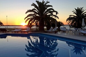 Indoor pool, outdoor pool, pool umbrellas, sun loungers