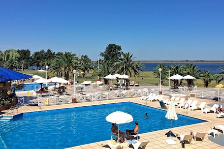 Indoor pool, outdoor pool, pool umbrellas, pool loungers