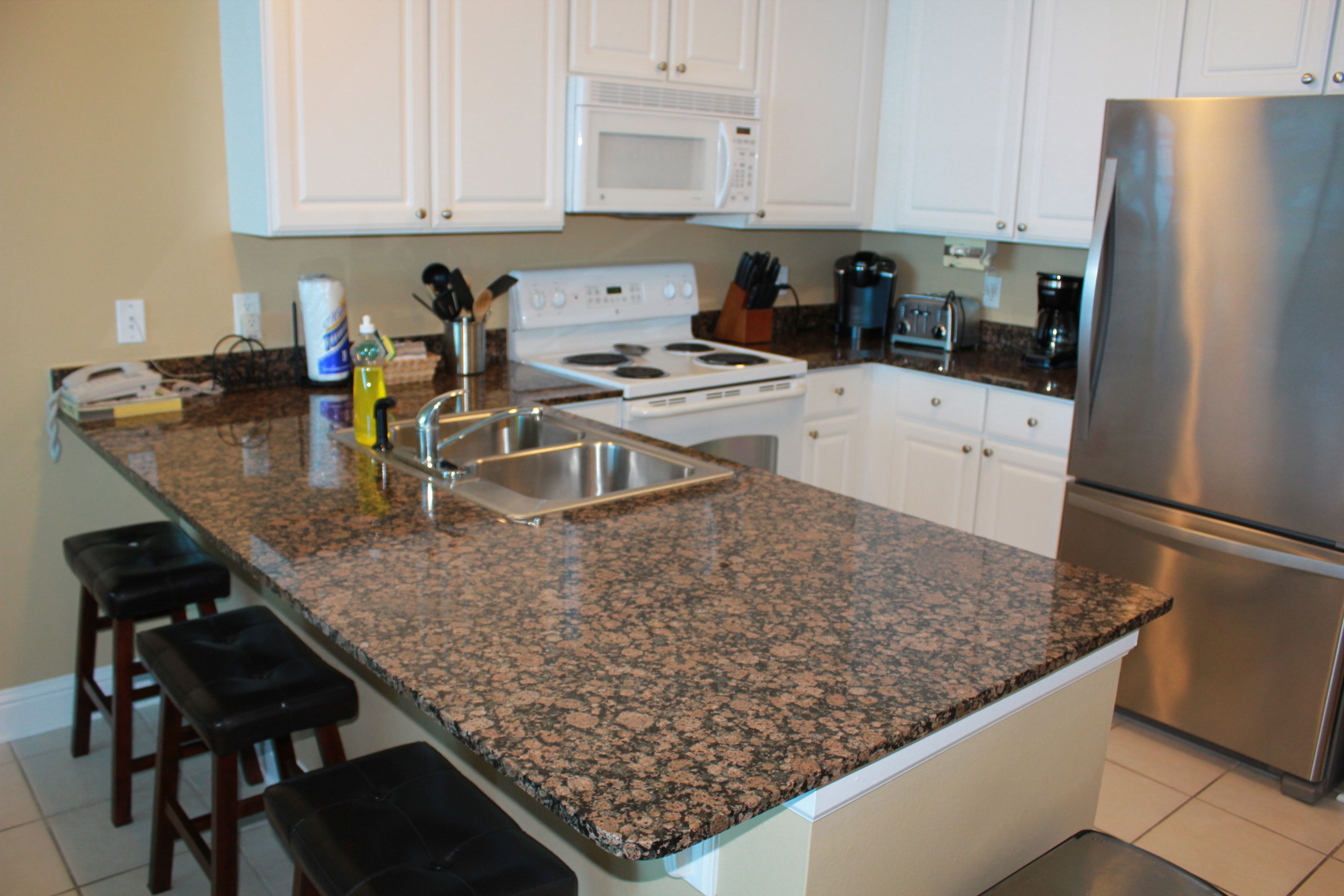 Condo, 2 Bedrooms, Balcony, Beachfront | Private kitchen | Full-size fridge, microwave, oven, stovetop