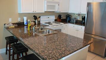 Condo, 2 Bedrooms, Balcony, Beachfront | Private kitchen | Full-size fridge, microwave, oven, stovetop