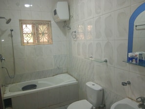Royal Room | Bathroom | Shower, rainfall showerhead, towels - Junbic Apartment and Suites (Abuja)