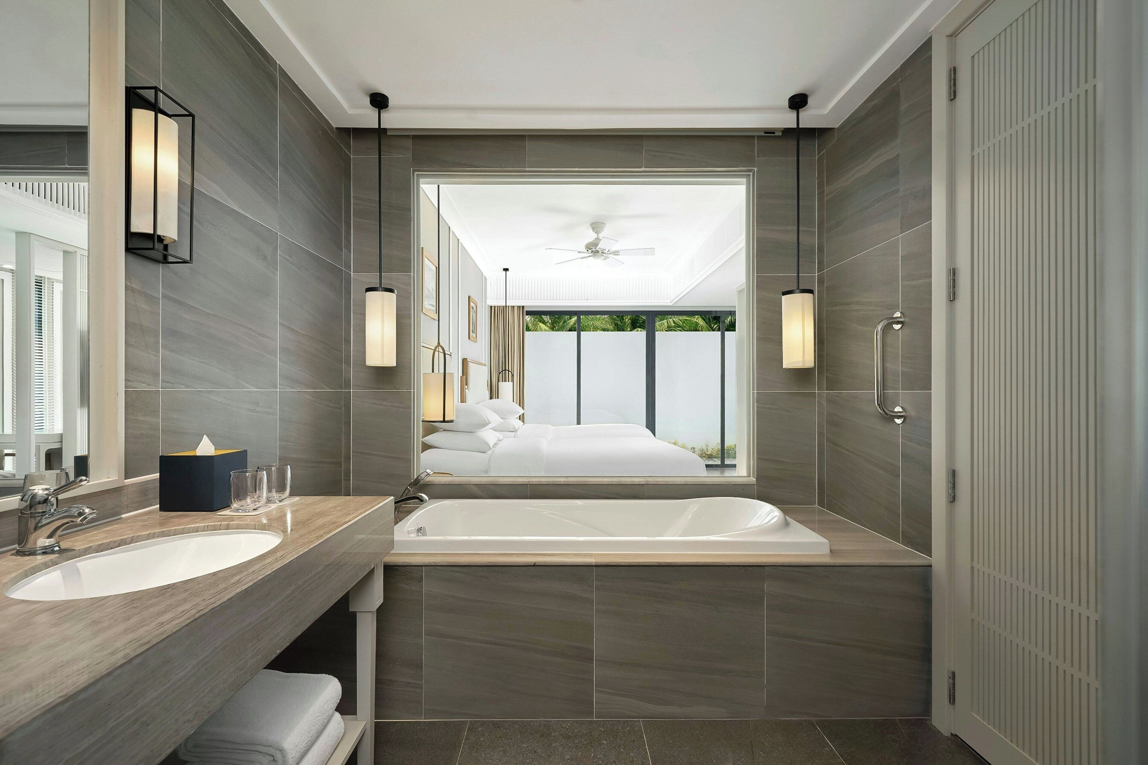 separate bathtub and shower, deep-soaking bathtub, designer toiletries