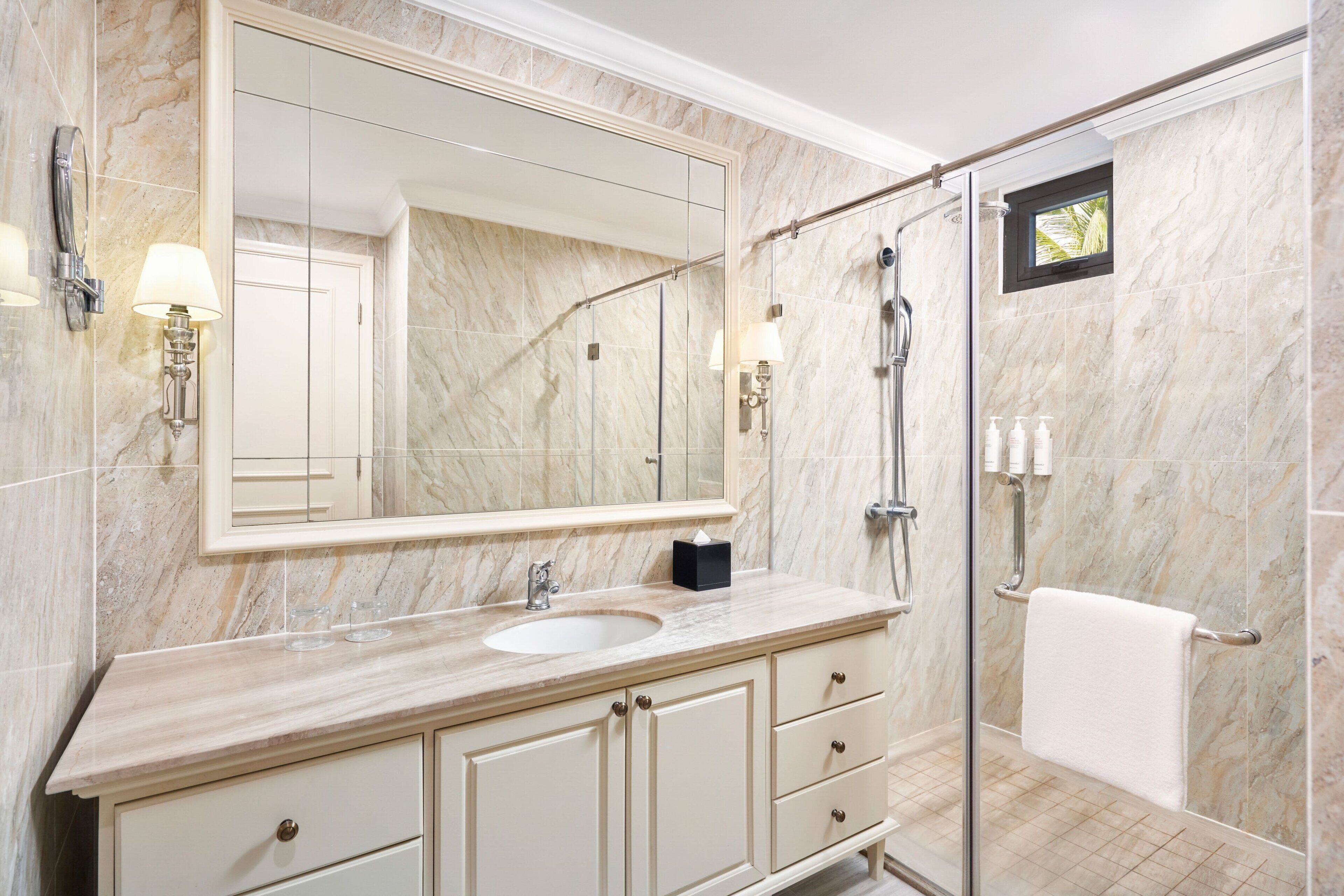 designer toiletries, hair dryer, bathrobes, slippers