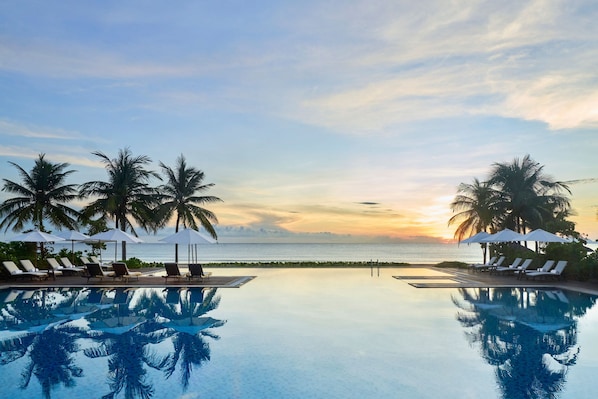 2 outdoor pools, pool umbrellas, lifeguards on site