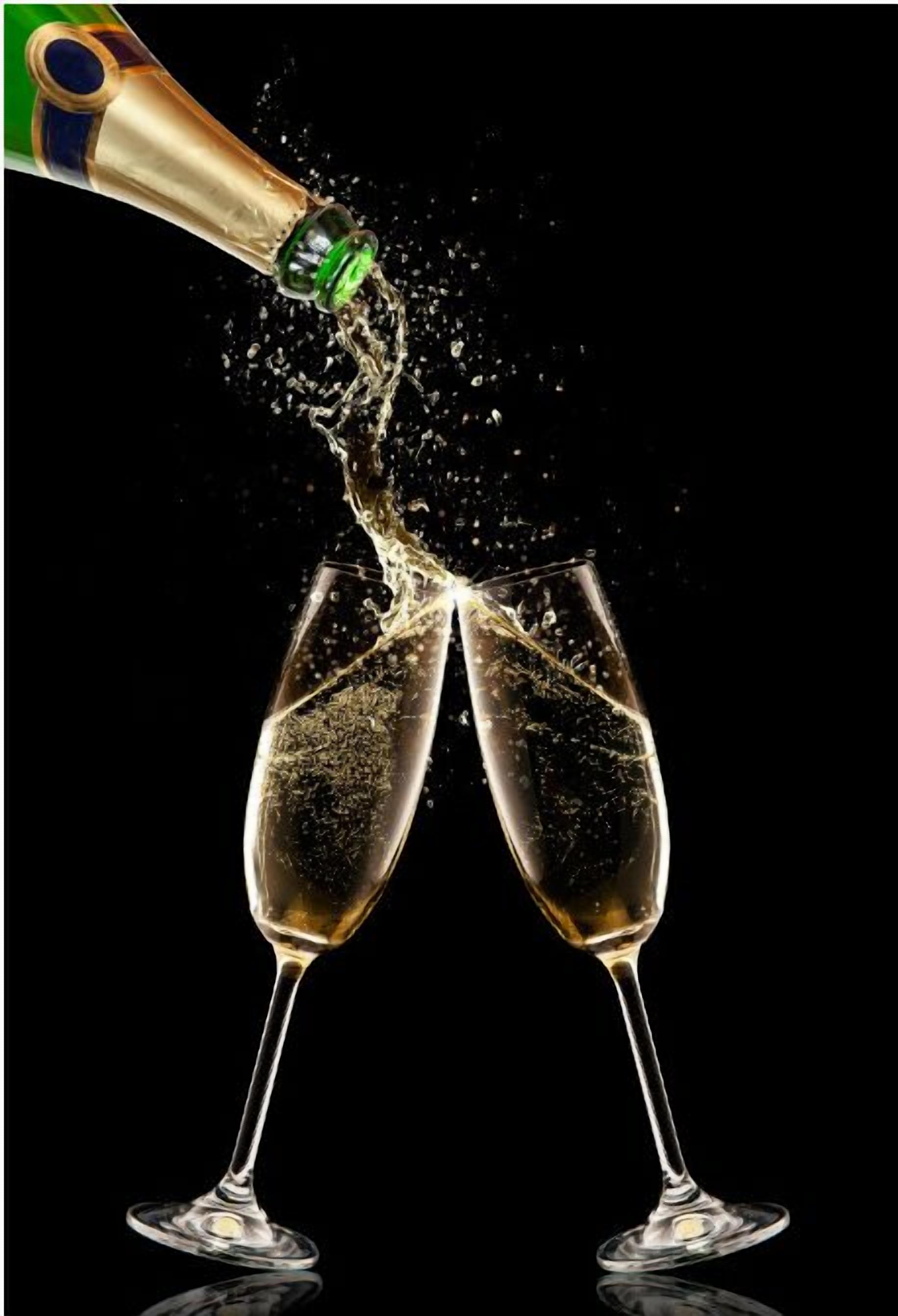 A champagne bottle being poured into two glasses, creating a splash.