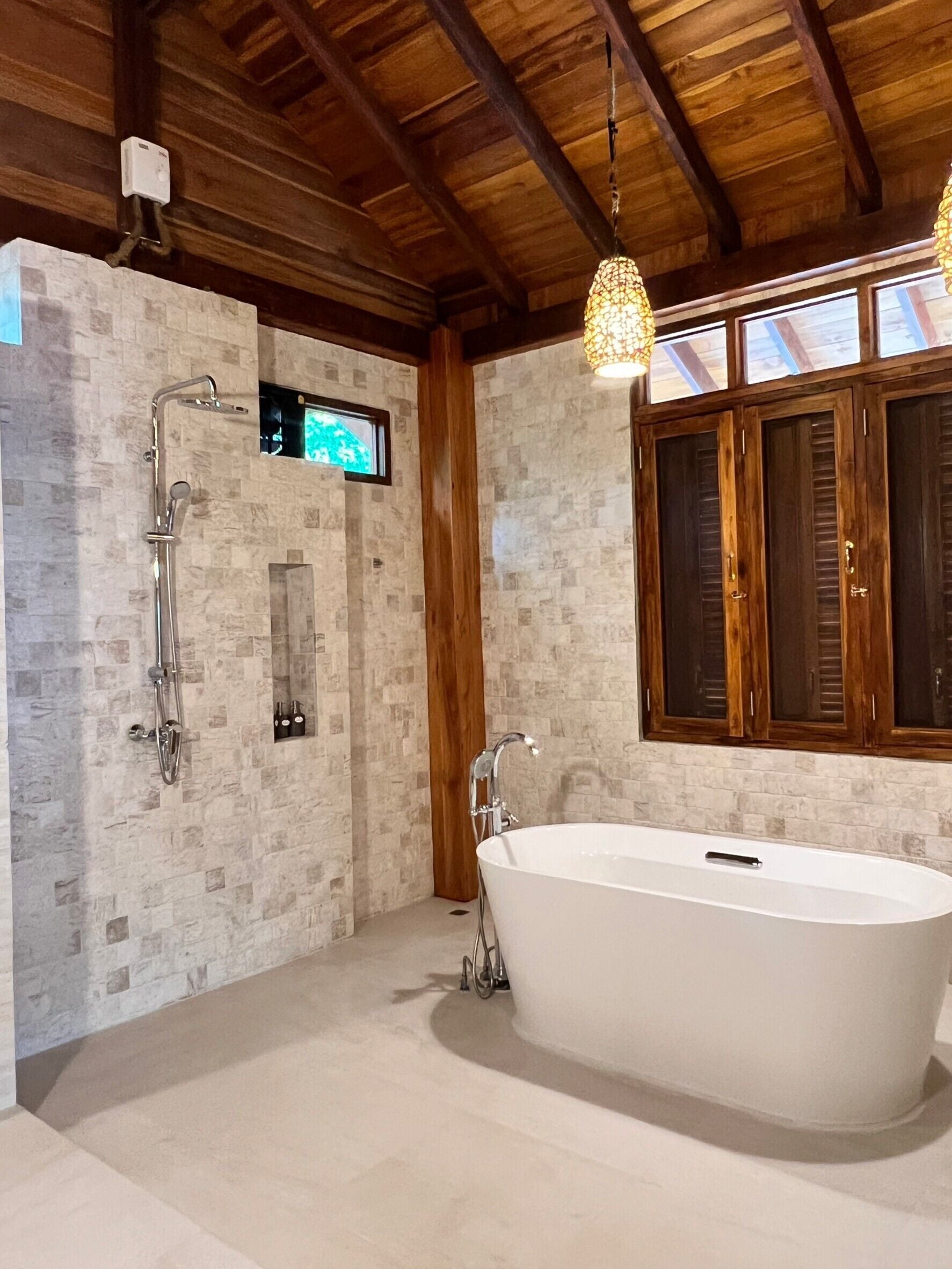 deluxe villa | bathroom | shower, free toiletries, hair dryer, towels