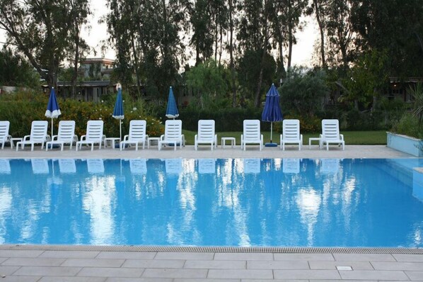 Outdoor pool, pool umbrellas, pool loungers