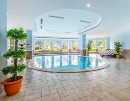 4 indoor pools, 4 outdoor pools, open 7:00 AM to 7:00 PM, pool umbrellas