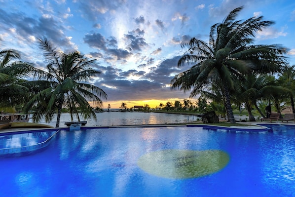 Outdoor pool, open 7:30 AM to 9 PM, pool loungers