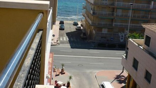 A coastal building with balconies overlooking the sea. - Hotel Tuto (Torrevieja)