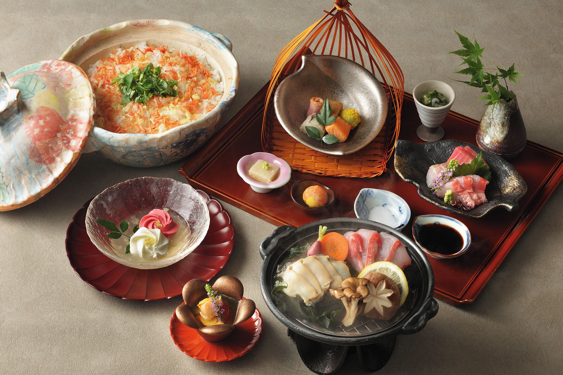 A traditional Japanese meal setup with various dishes and utensils.