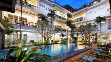 Outdoor pool, open 9:00 AM to 9:00 PM, pool umbrellas, pool loungers