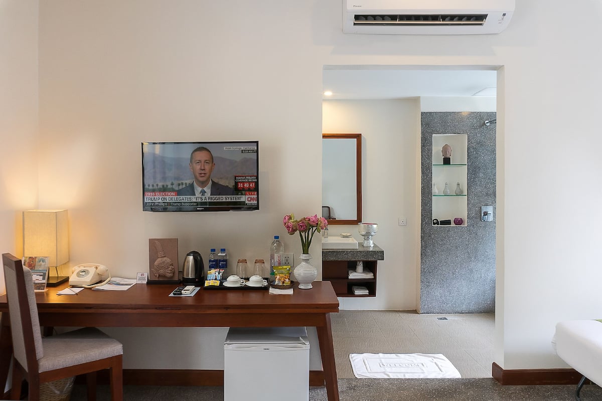 king suite with balcony pool view - free pick up | bathroom | designer toiletries, hair dryer, bathrobes, slippers