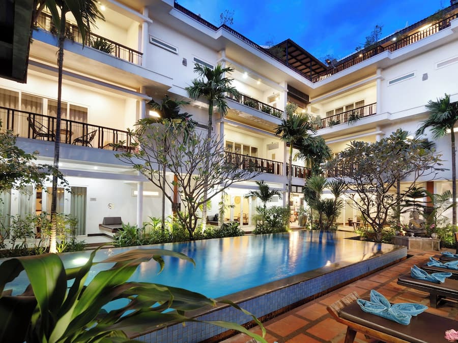 Outdoor pool, open 9:00 AM to 9:00 PM, pool umbrellas, pool loungers