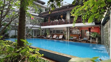 Outdoor pool, open 9:00 AM to 9:00 PM, pool umbrellas, pool loungers