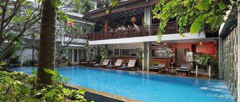 Outdoor pool, open 9:00 AM to 9:00 PM, pool umbrellas, sun loungers