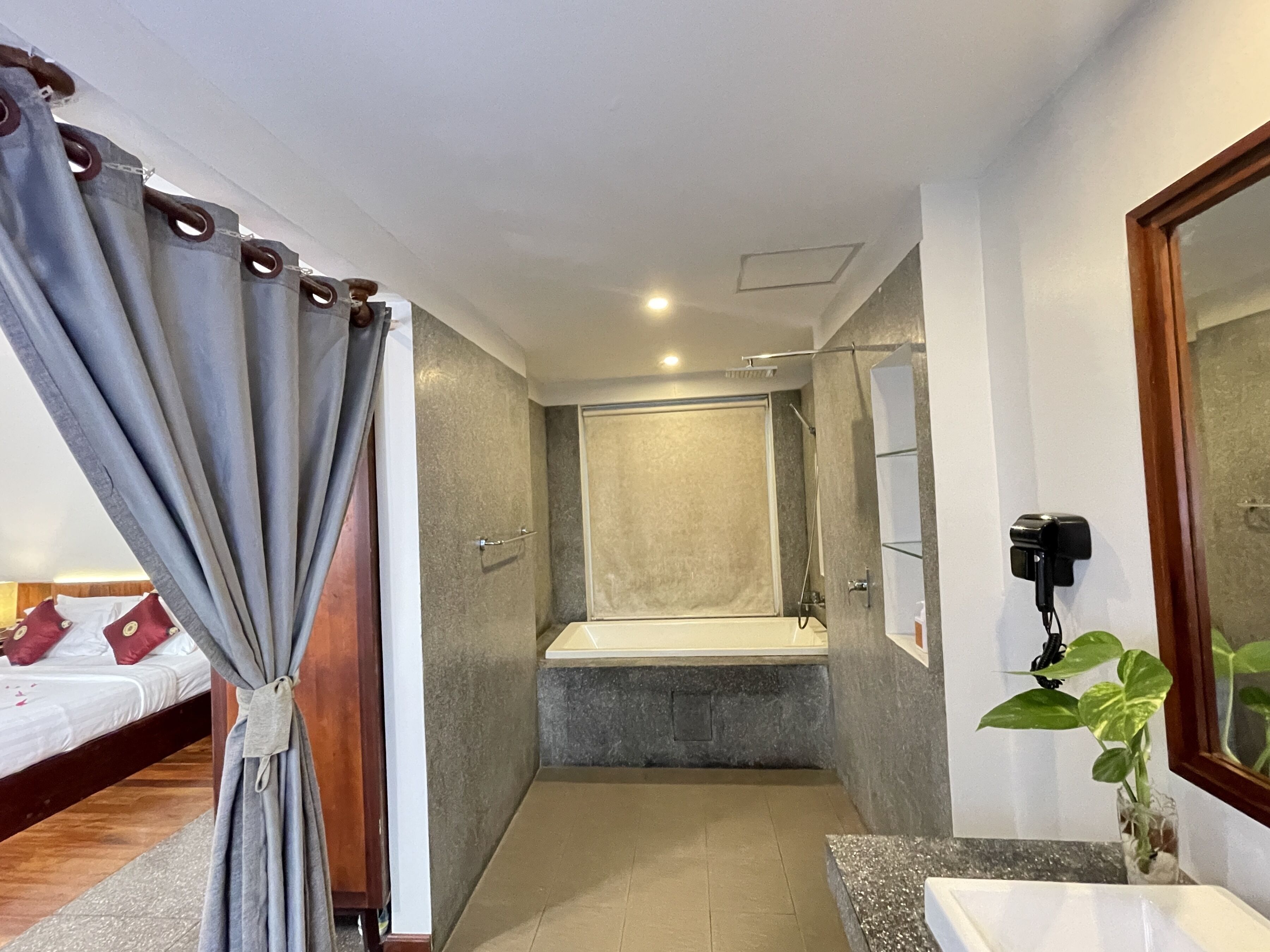honeymoon suite with balcony pool view | bathroom | designer toiletries, hair dryer, bathrobes, slippers
