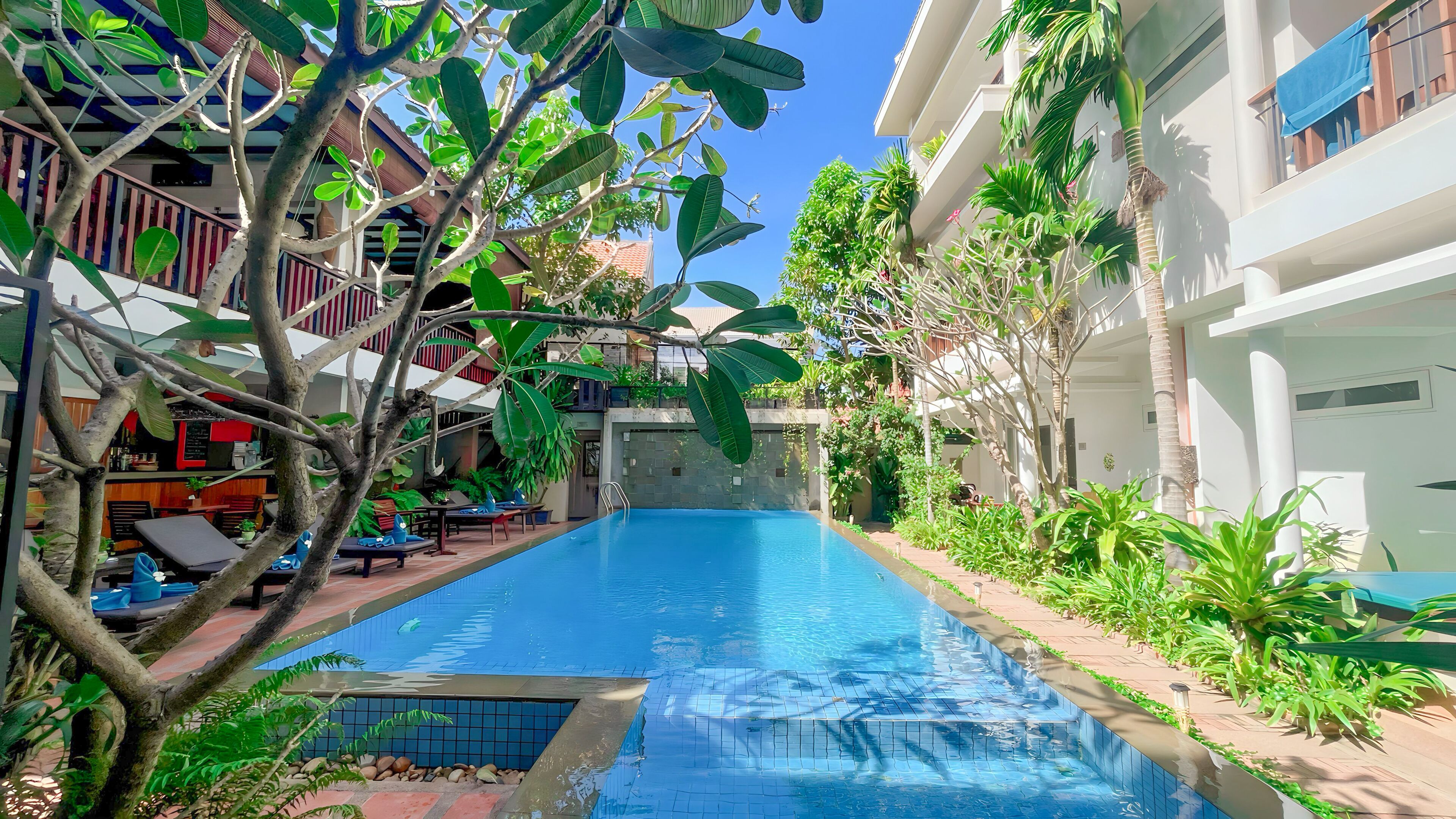 outdoor pool, open 9:00 am to 9:00 pm, pool umbrellas, pool loungers