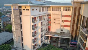 A multi-story hotel with balconies, a rooftop terrace, and a sign for 'Hotel Samana'. - Hotel Samana (Hetauda)