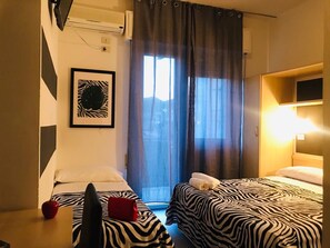 Triple Room, Balcony | Individually decorated, individually furnished, desk, laptop workspace