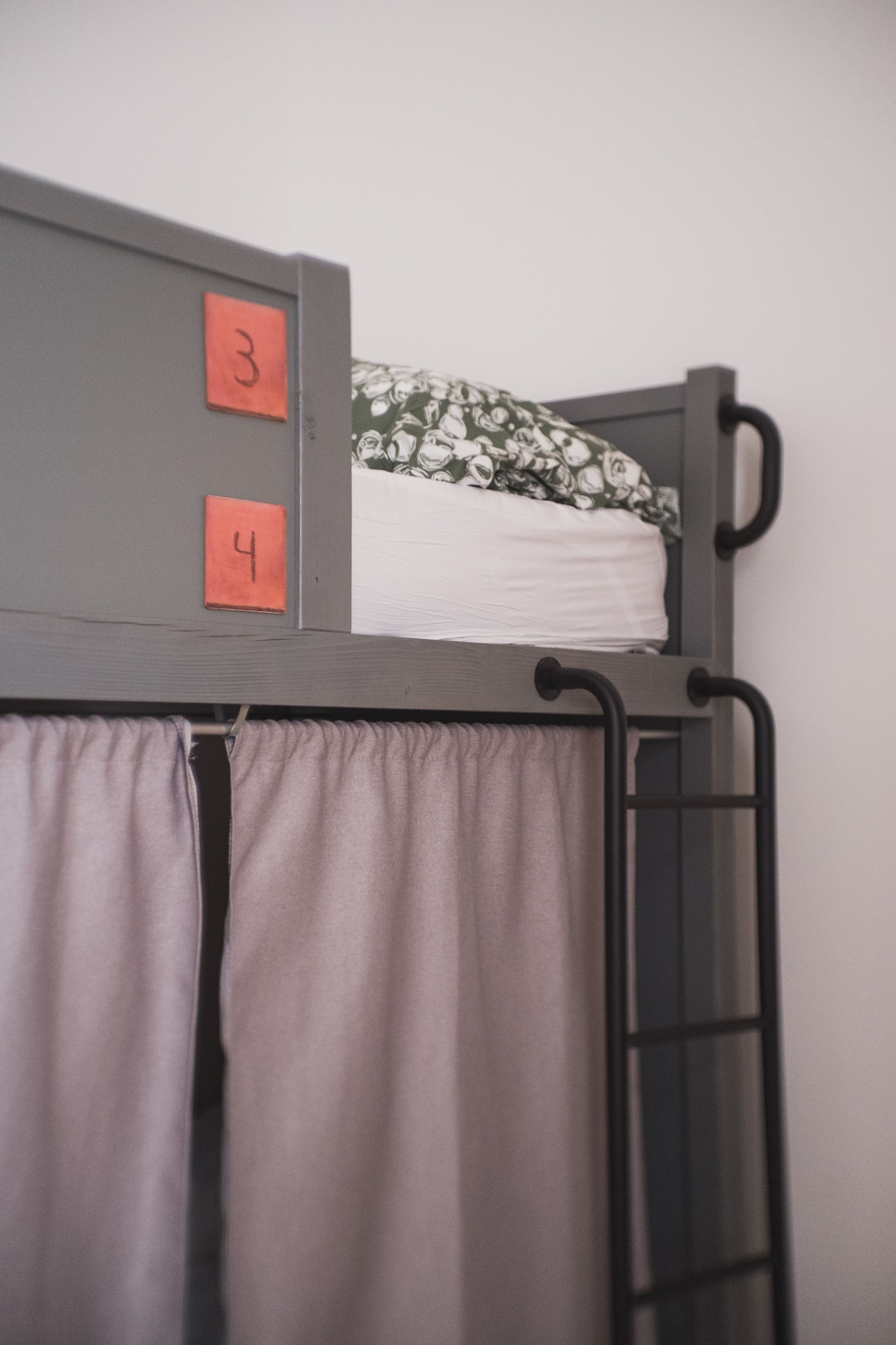 A bunk bed with two compartments, each marked with a number.