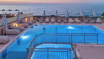 Seasonal outdoor pool, pool umbrellas, sun loungers