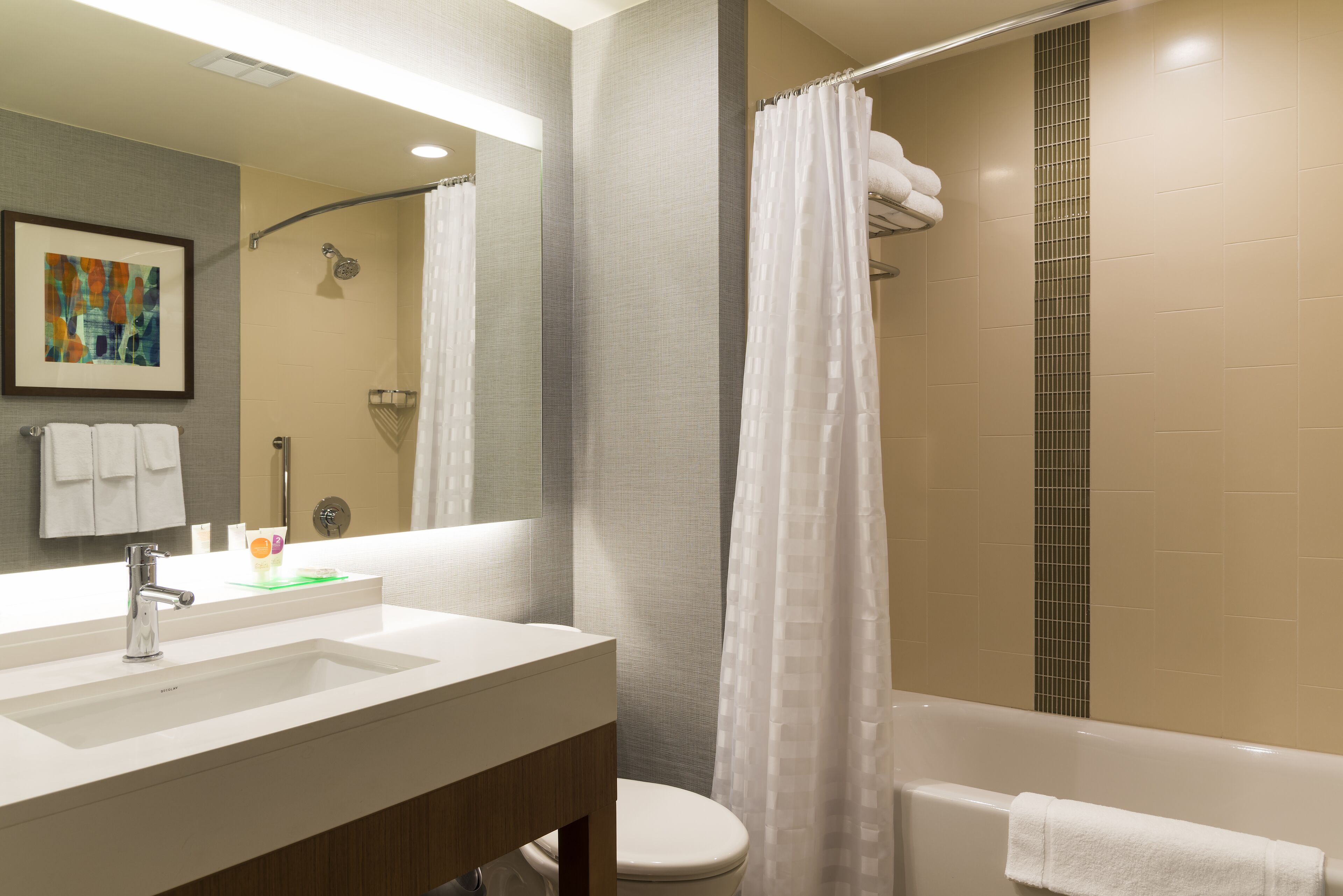 designer toiletries, hair dryer, towels