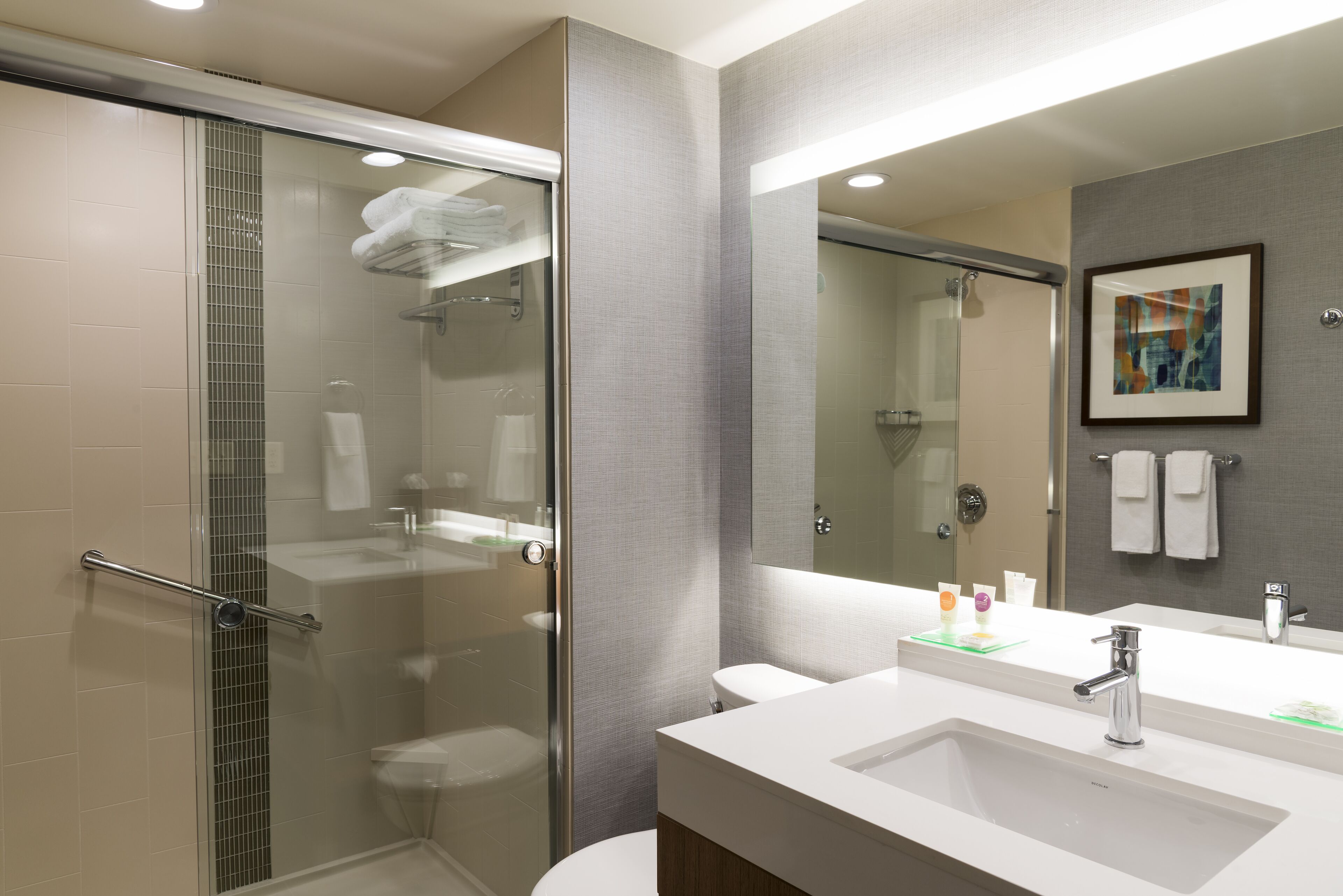 designer toiletries, hair dryer, towels