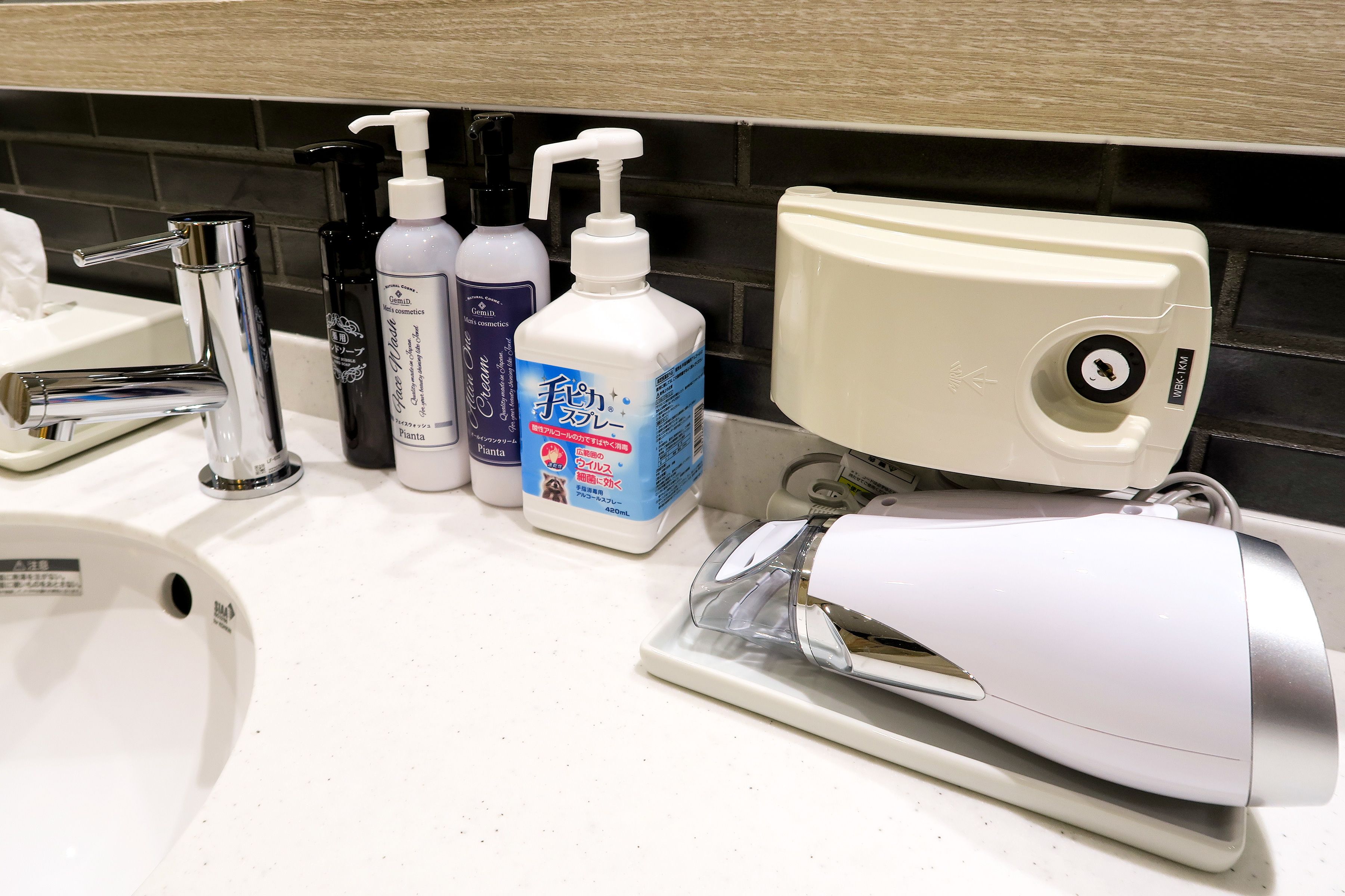 shower, hair dryer, slippers, towels