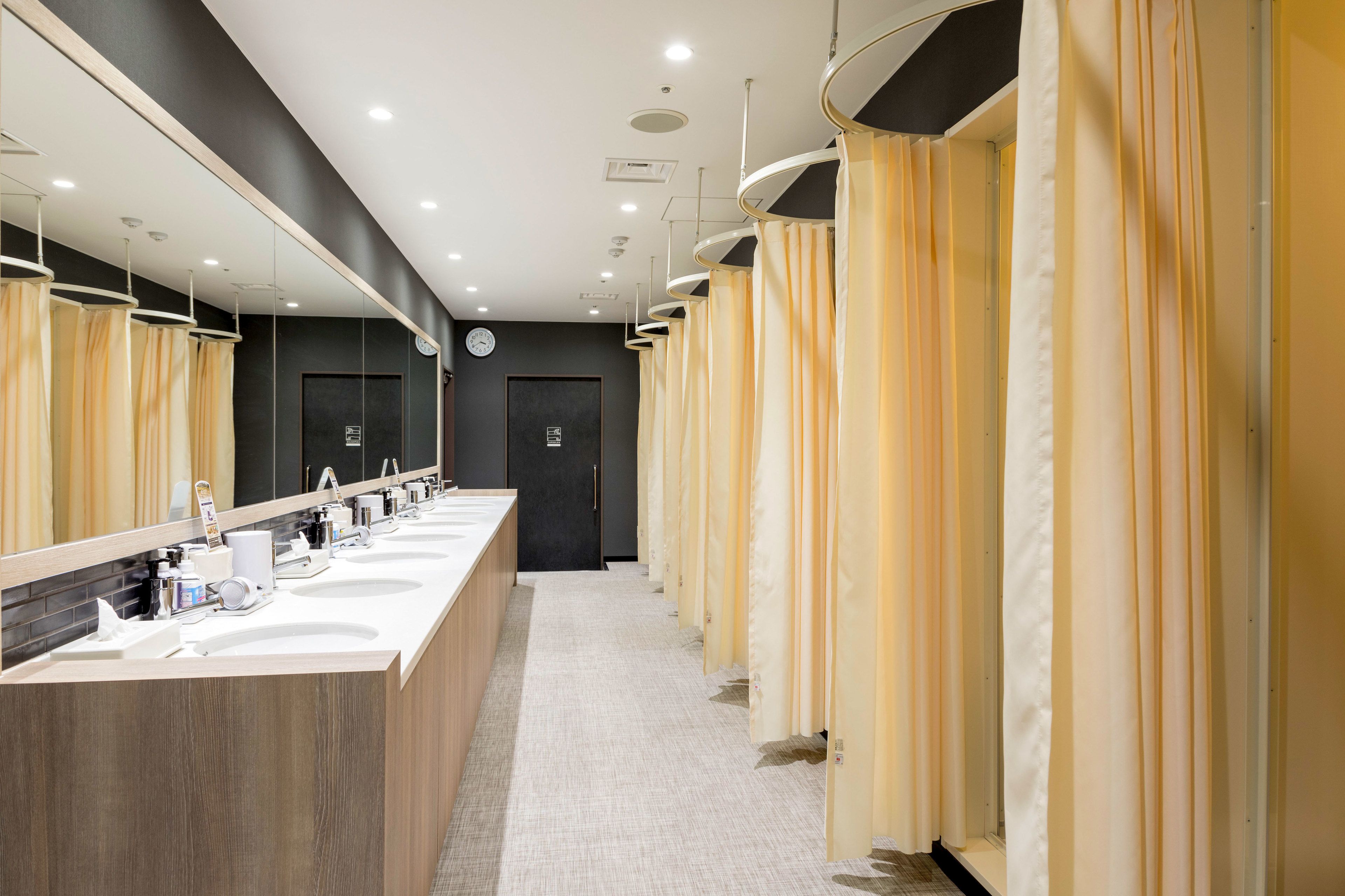 shower, hair dryer, slippers, towels