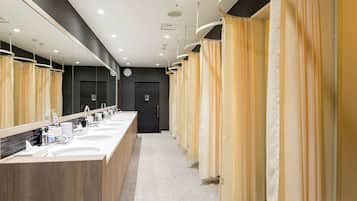 Shower, hair dryer, slippers, towels