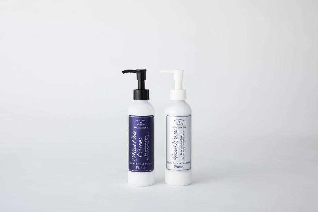 Two bottles of men's skincare products with pumps, one with a black pump and the other with a white pump.