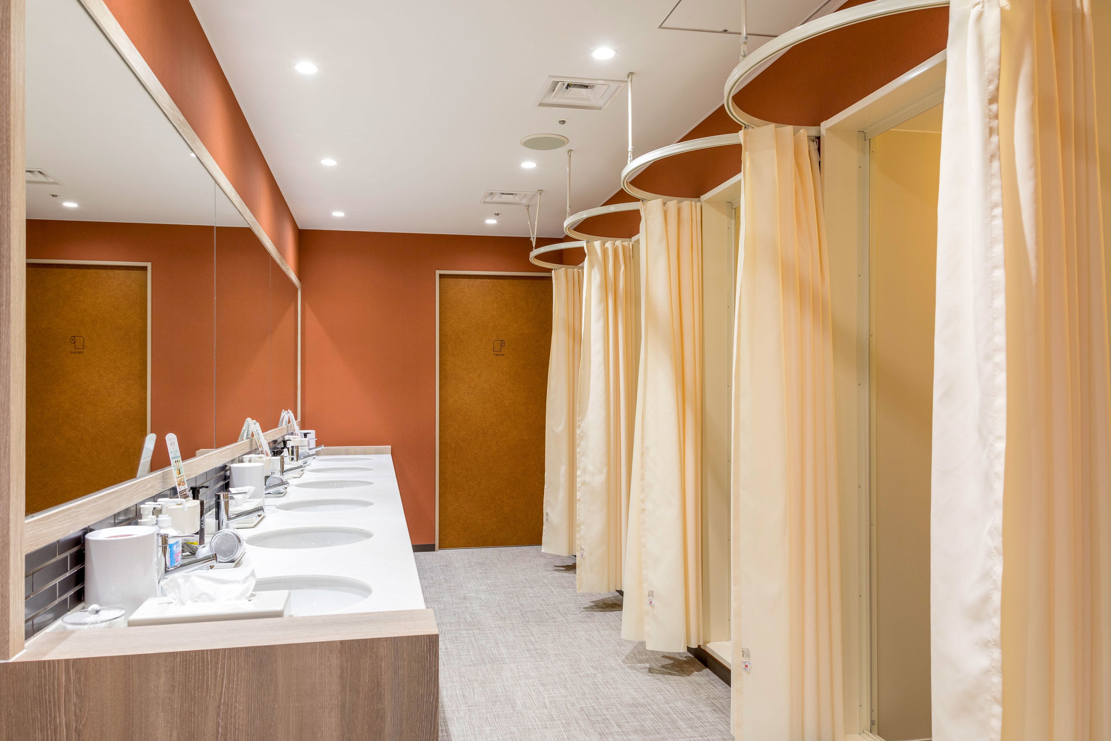 shower, hair dryer, slippers, towels