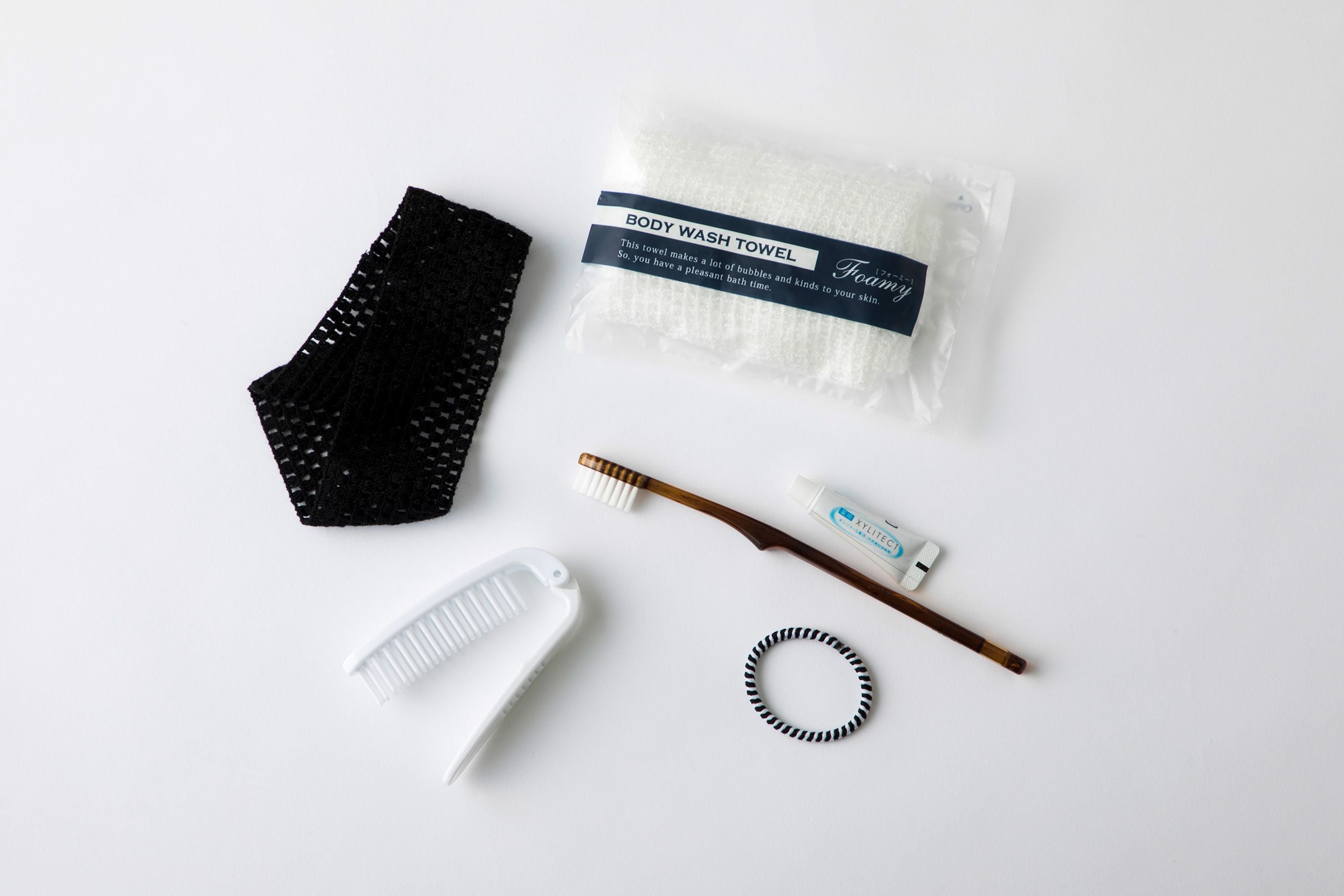 shower, hair dryer, slippers, towels