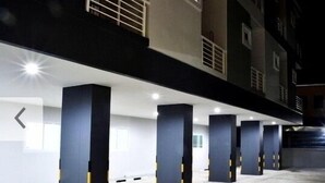 A parking garage with multiple columns and a clean, modern design.