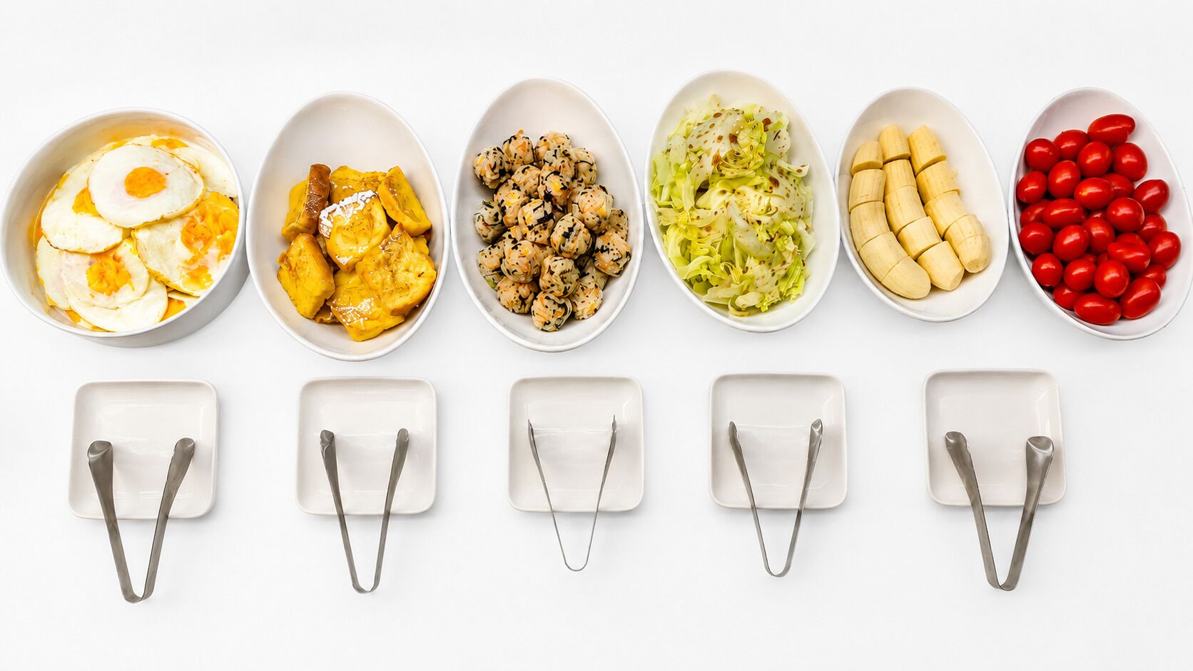 A row of white bowls with various food items and empty square plates with spoons.