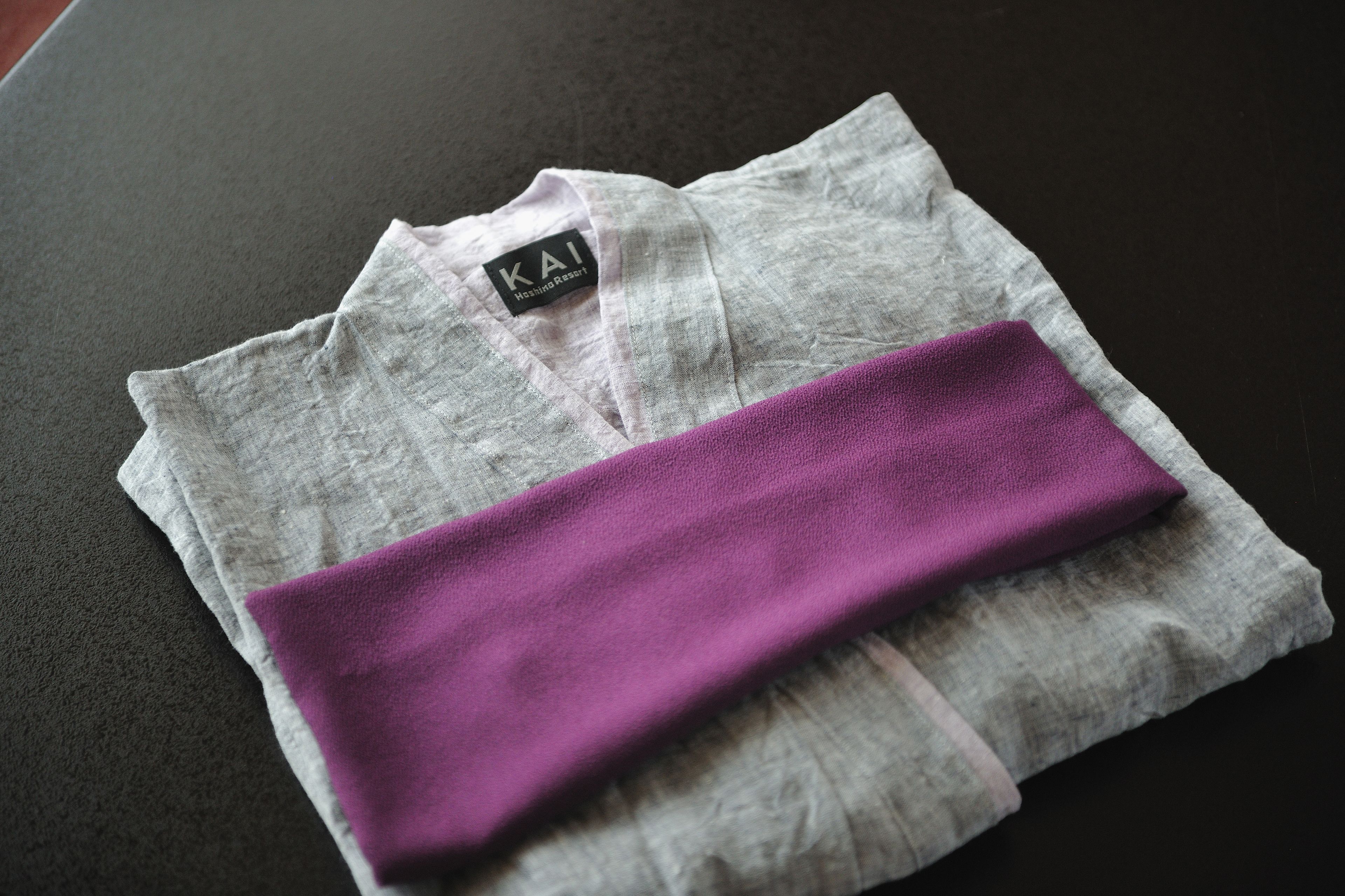 A folded piece of clothing with a label reading "KAI Morning Resort".