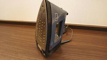 A portable iron on a wooden floor.
