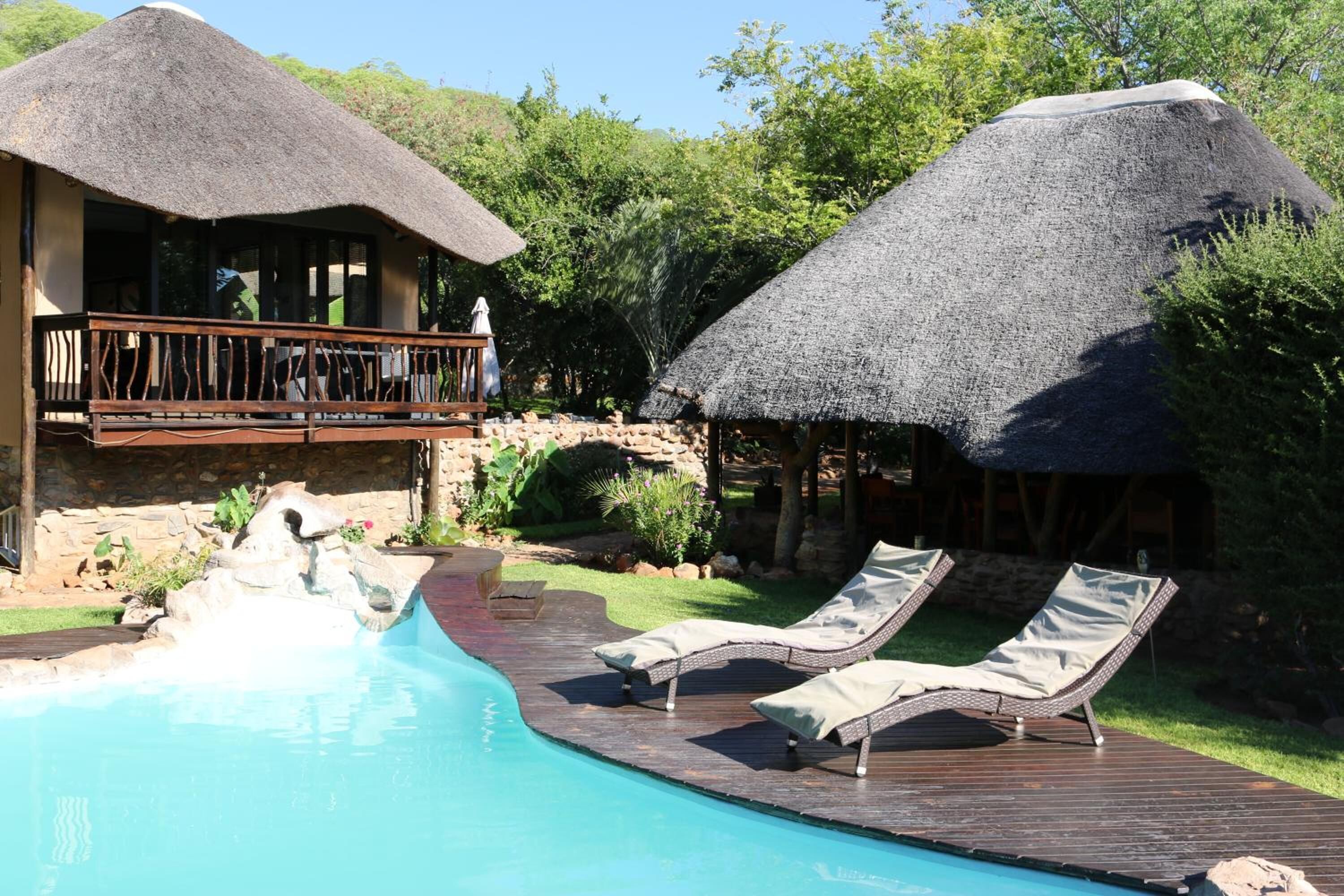 Outdoor pool, pool umbrellas, sun loungers