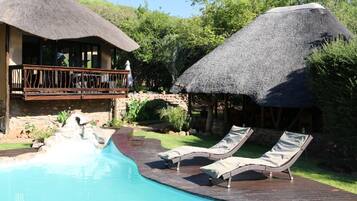 Outdoor pool, pool umbrellas, sun loungers