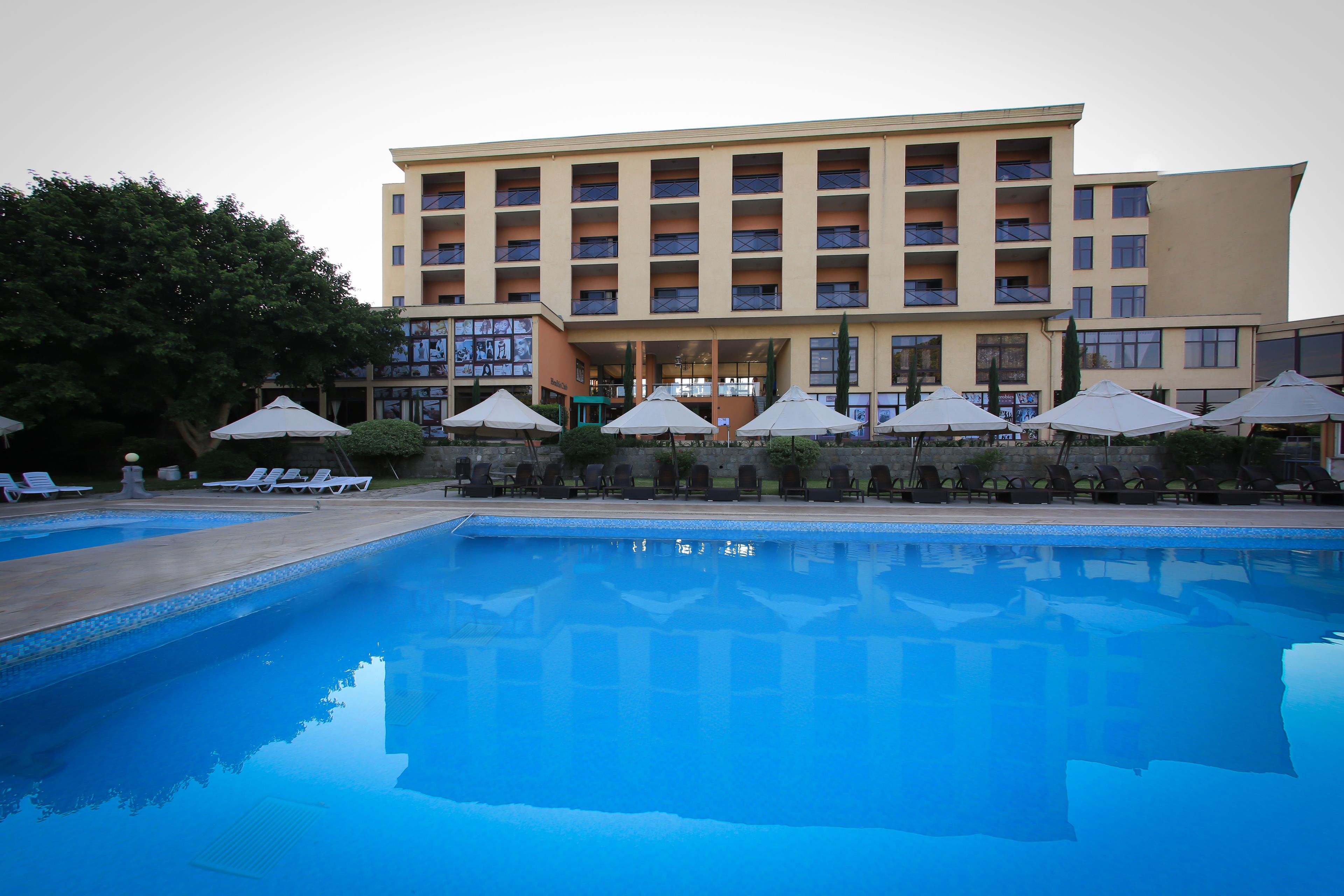 Outdoor pool, pool umbrellas, sun loungers