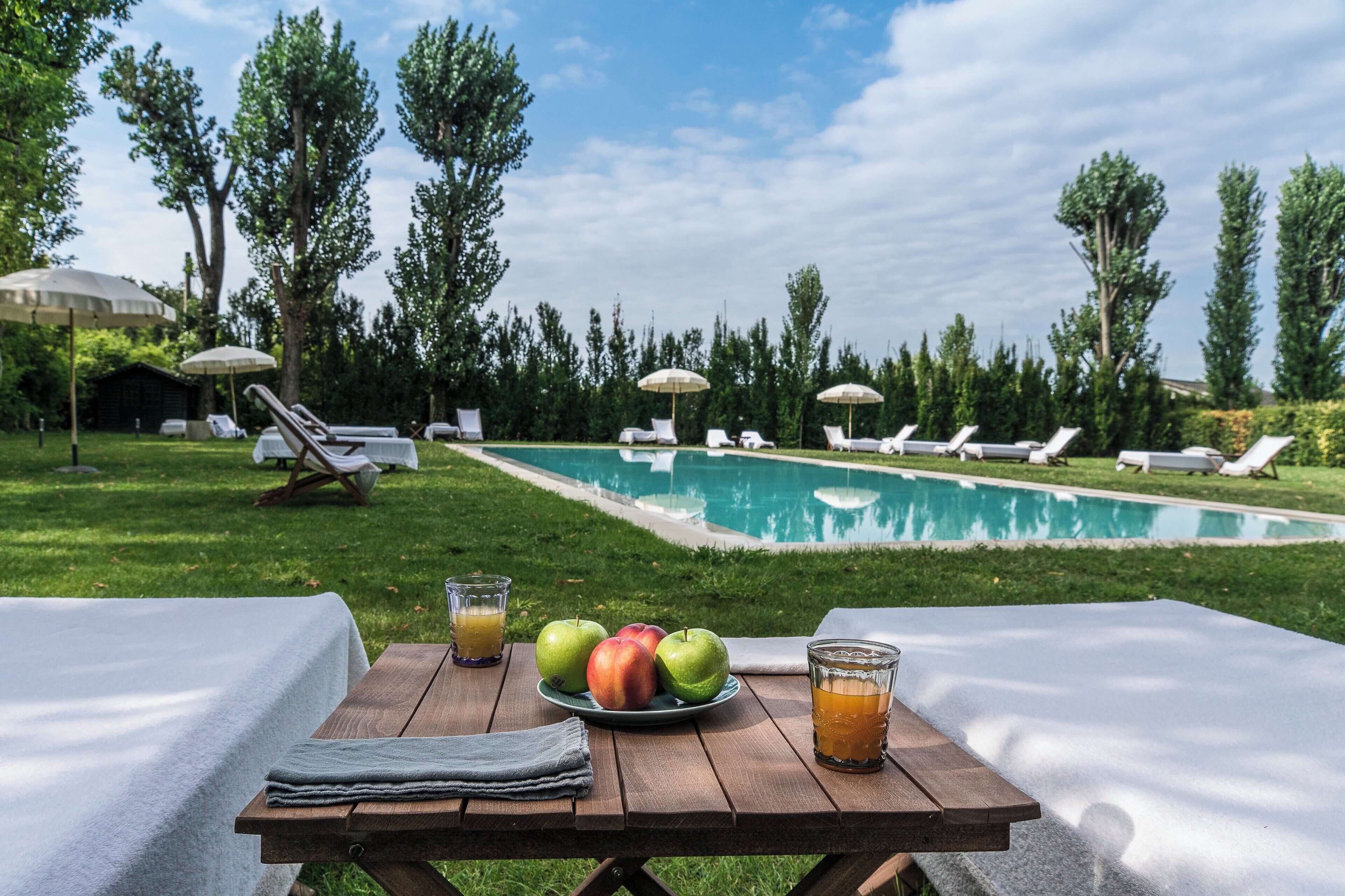 seasonal outdoor pool, open 8:00 am to 8:00 pm, pool umbrellas